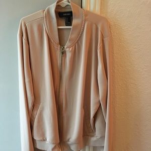 A light pink bomber jacket